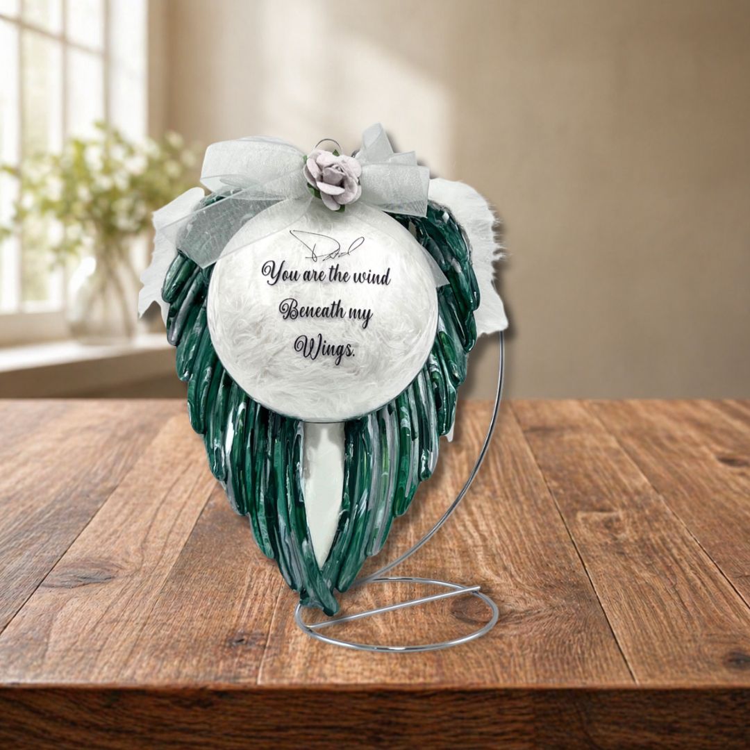 Personalized green angel wings memorial ornament with laser engraved glass ornament displayed on stand