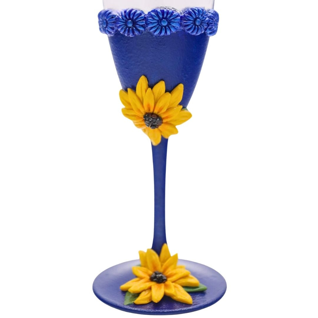 blue sunflower champagne flute detail hand sculpted yellow flower on blue stemware wedding glass darees designs