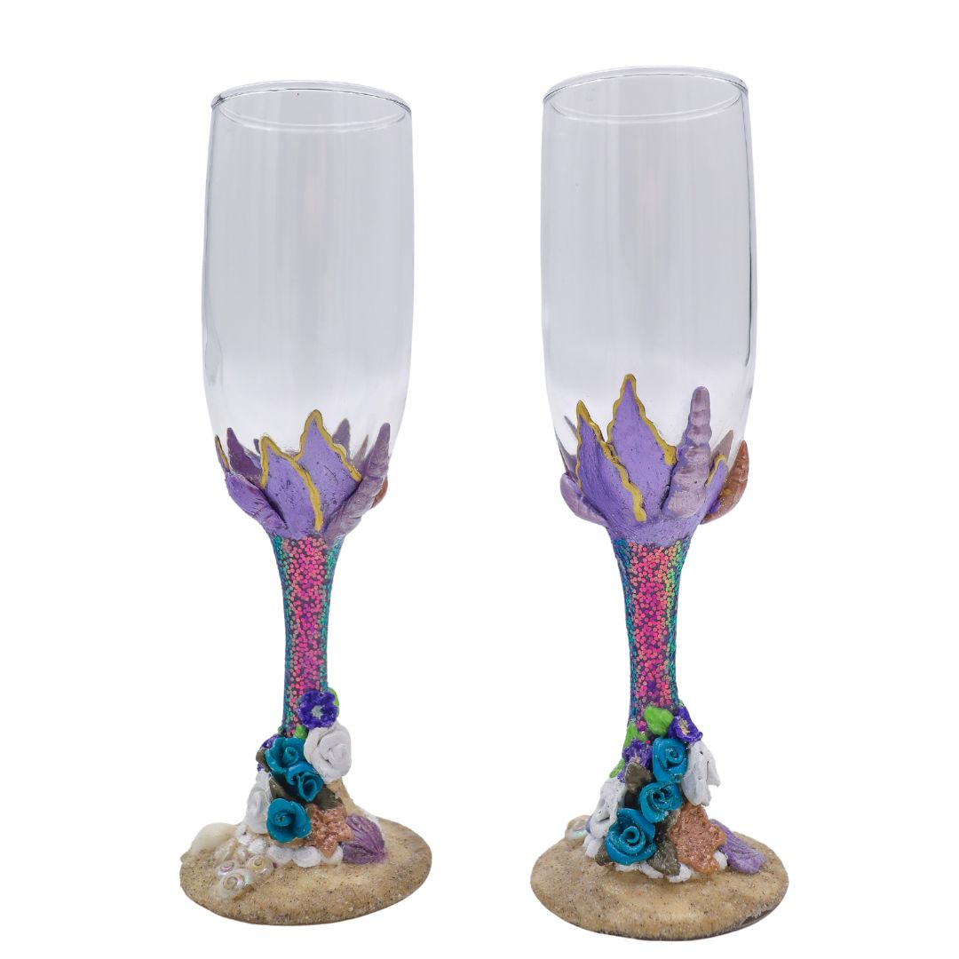 Hand-sculpted beach champagne flutes with tropical flowers and real seashell base.