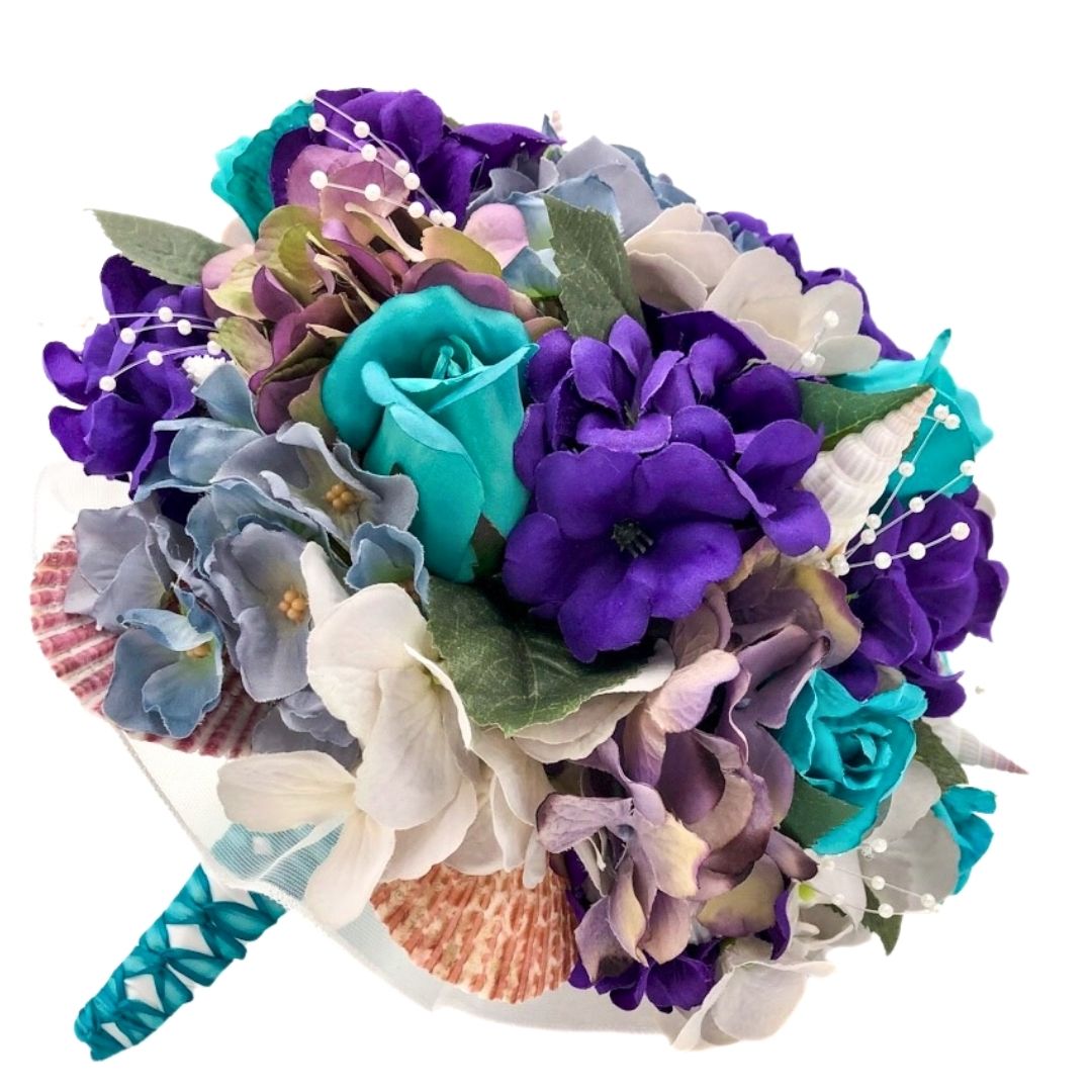 Purple and turquoise seashell bridal bouquet with coastal flowers, designed for beach weddings and destination brides by Daree’s Designs