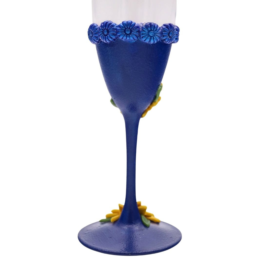Back view of handmade champagne flute with sapphire blue polymer clay and sculpted texture detail