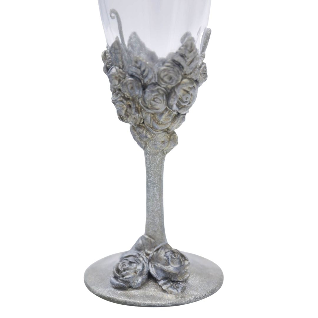 Side view of hand sculpted silver floral champagne flute with Victorian inspired detailing