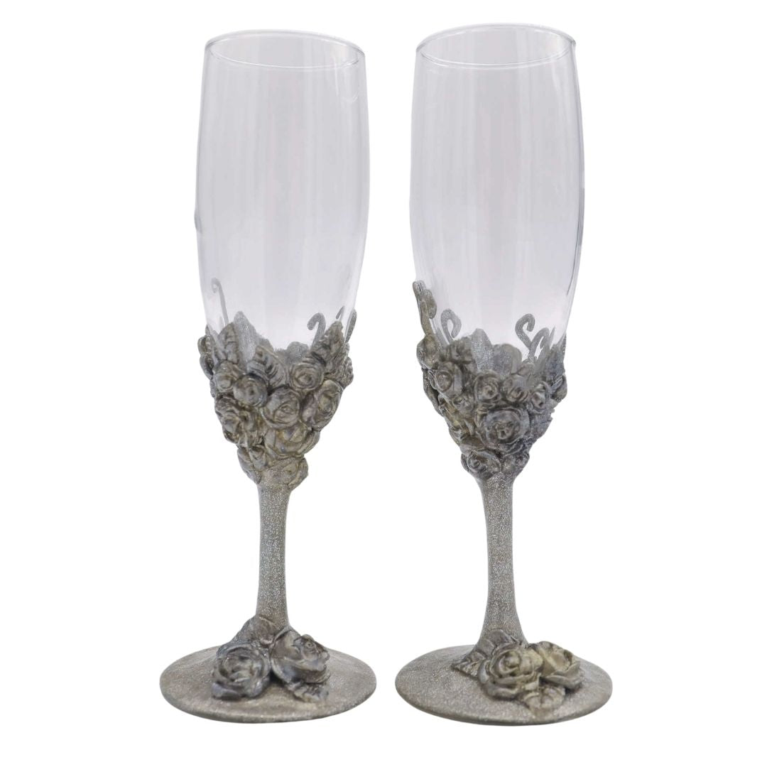 Hand sculpted silver rose champagne flute set with Victorian inspired metallic floral detailing and sculpted stems