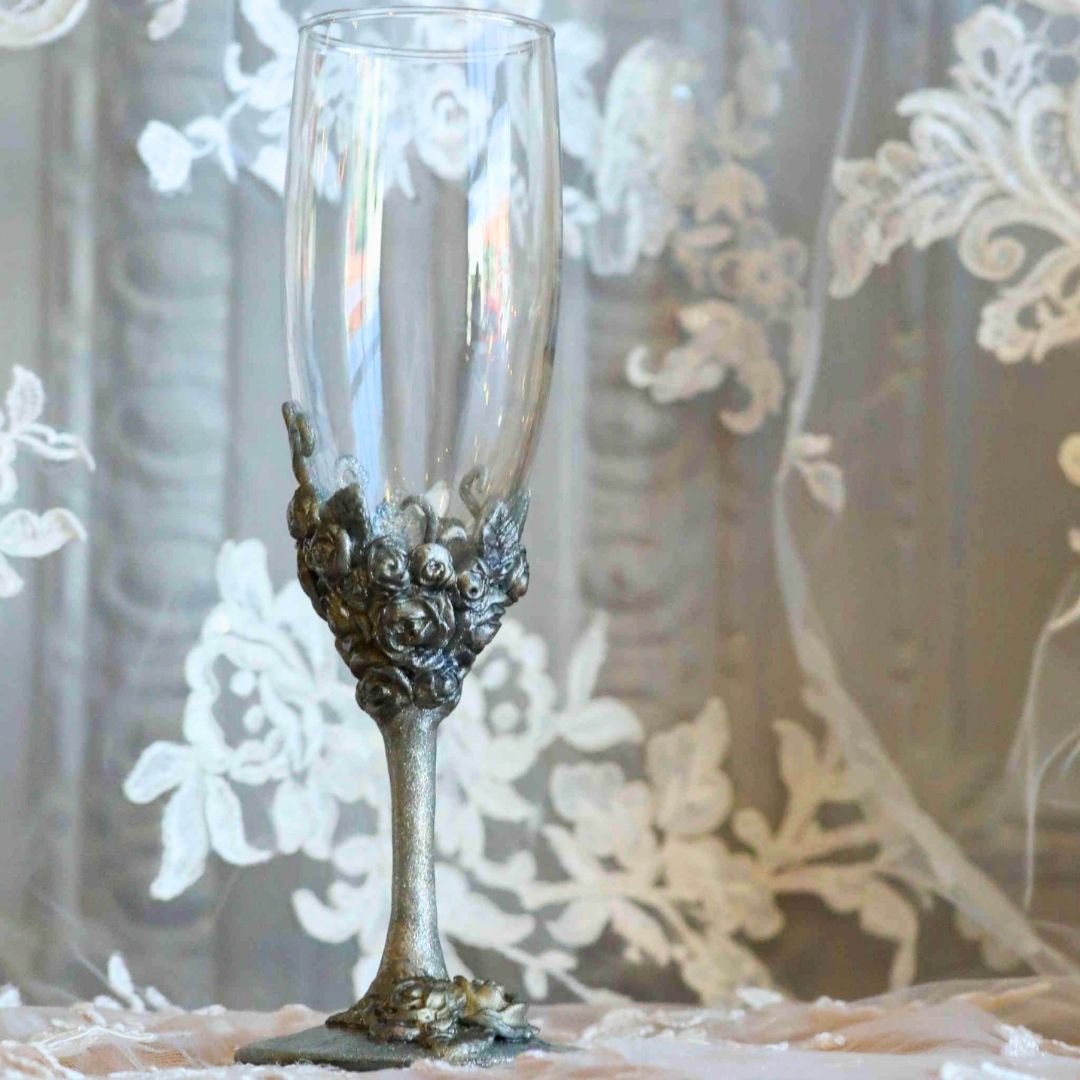 Single silver rose champagne flute with sculpted metallic floral detailing and Victorian styling