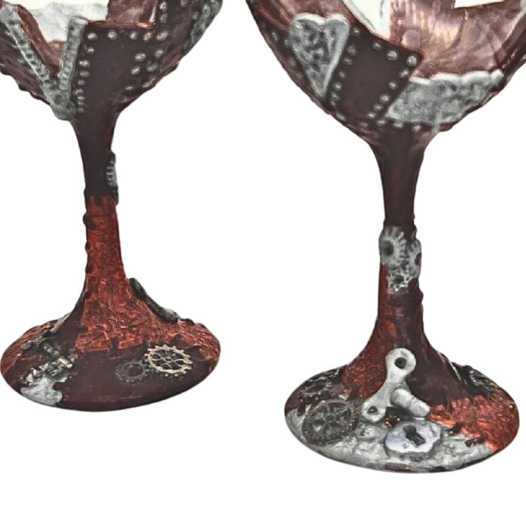 Back view of steampunk wine glasses showing hand sculpted polymer clay panels, textured copper finish, and mechanical gear details by Daree’s Designs