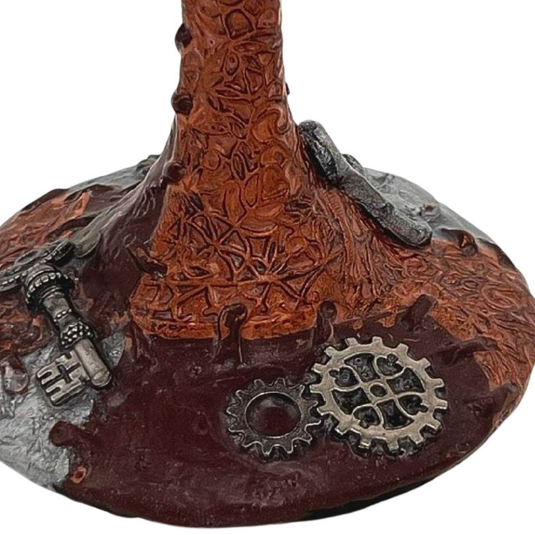 Hand sculpted steampunk wine glasses with copper polymer clay, silver stitching details, and gear embellishments on the base, handmade by Daree’s Designs