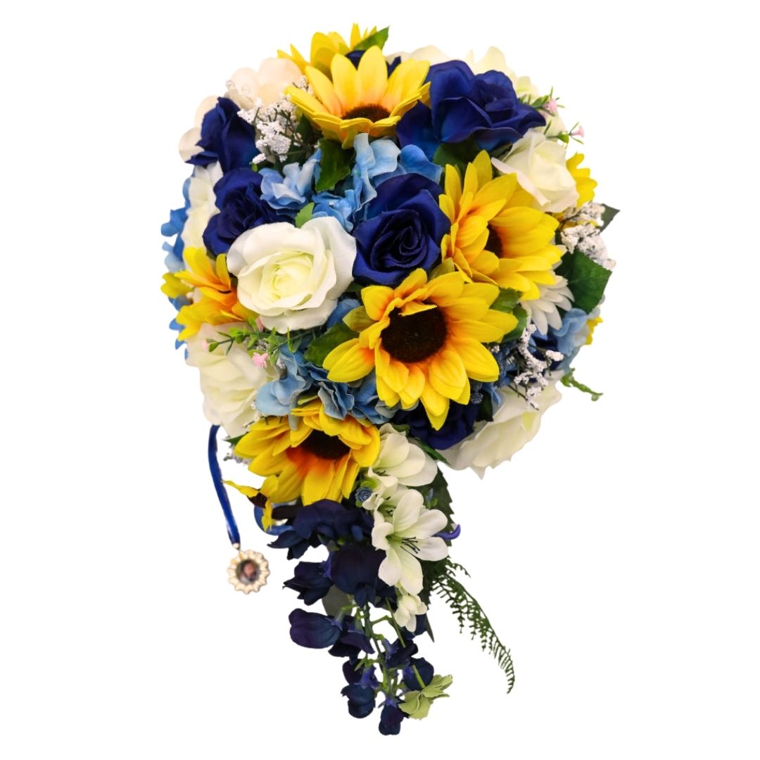 Extra large cascading bridal bouquet with sunflowers, sapphire blue roses, ivory roses, and blue hydrangea in a teardrop shape with trailing florals and optional memorial photo charm