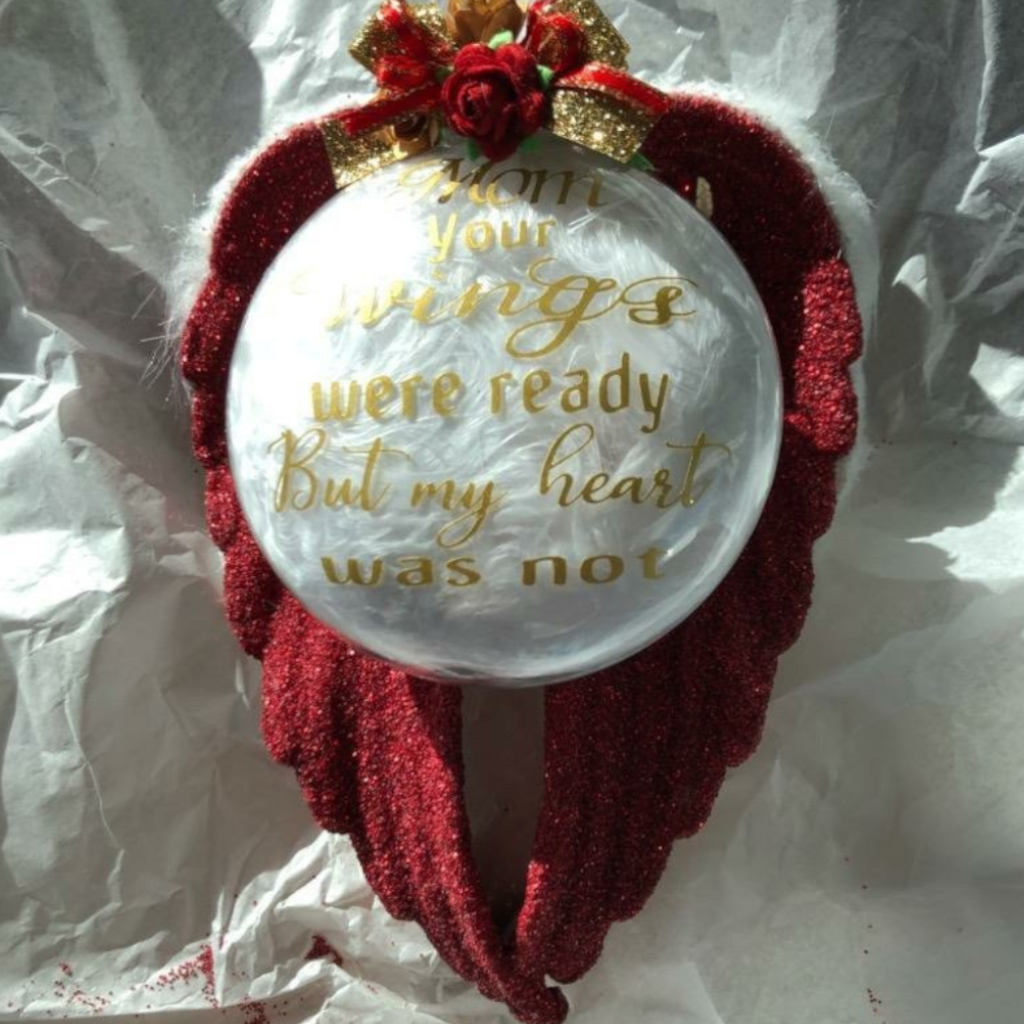 These acrylic ornaments are made in a variety of colors with custom verses, and adorned with glitter, feathers, fur, charms, flowers, or other decorative elements dependent on your selection.