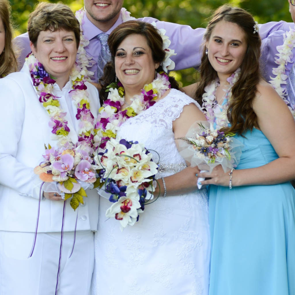 Bring the beach to your summer or tropical wedding ceremony set in greenery and adorned with cone shells and small silk flowers.