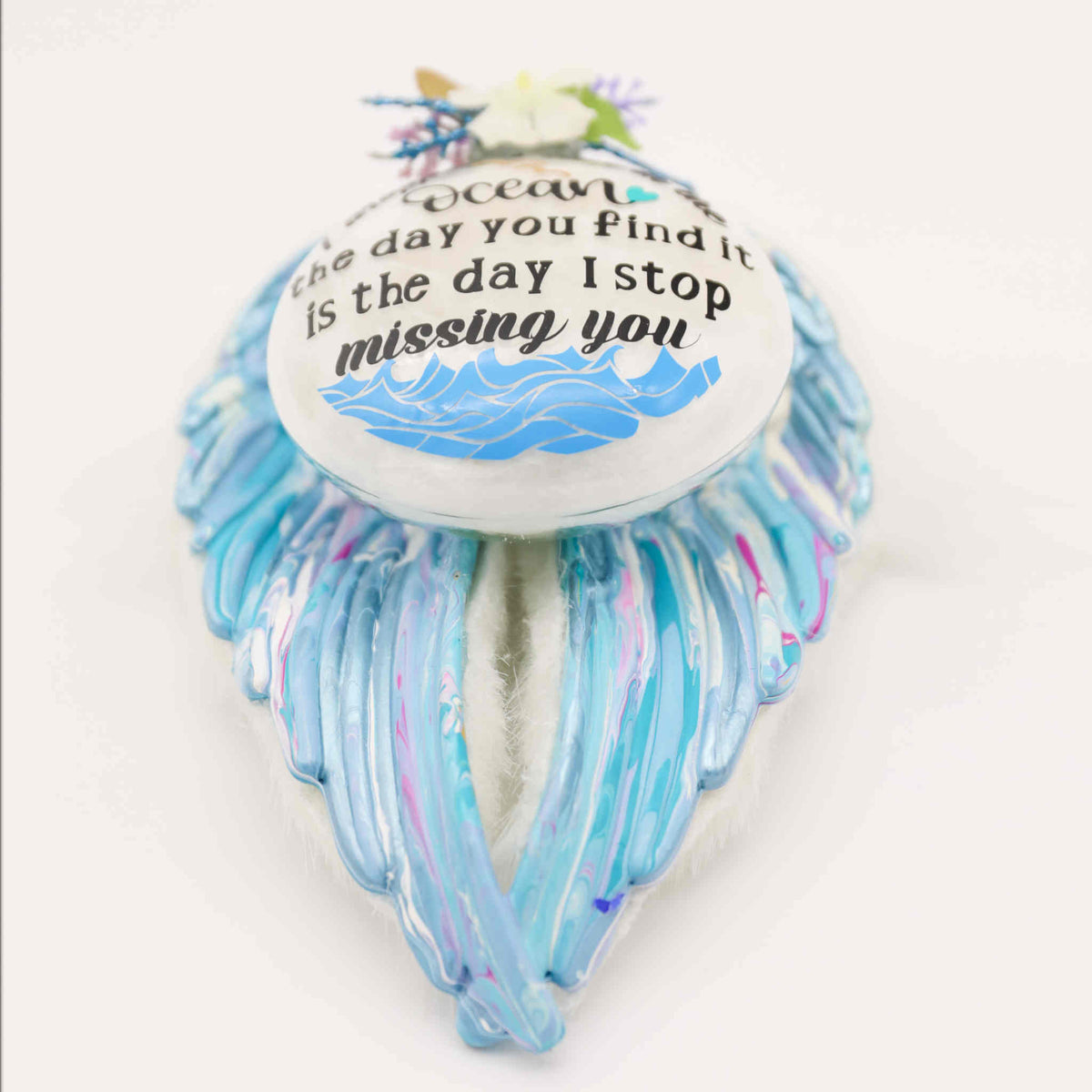 These poured acrylic ornaments are made in a variety of colors with custom verses, and adorned with feathers, fur, charms, flowers, or other decorative elements dependent on your selection.