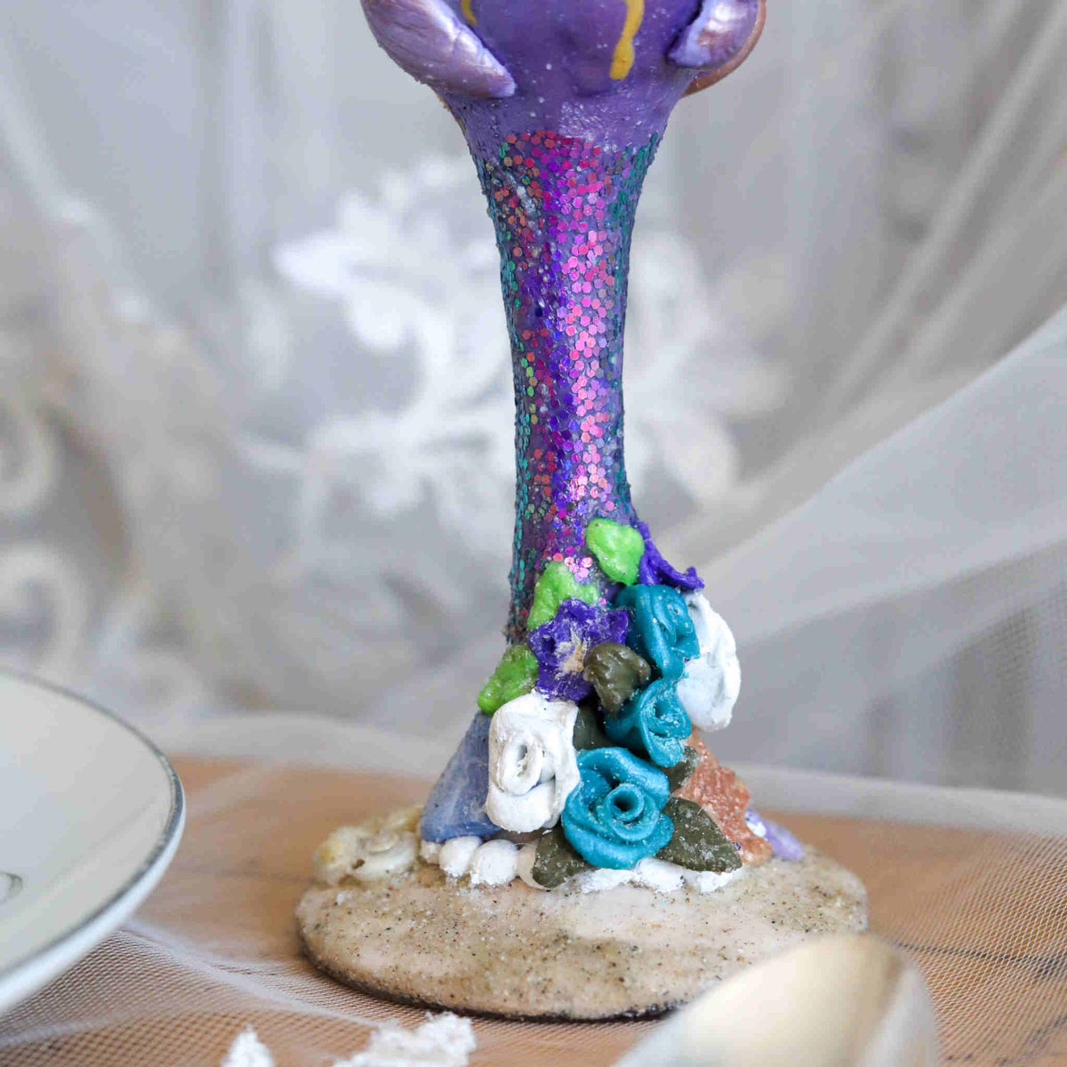 Enjoy the sea and sand while you toast to each other on your special wedding day or wedding anniversary. Each flute is hand-scuplted and painted with purple, teal, and white tiny seashells and flowers using polymer clay and sealed to last.