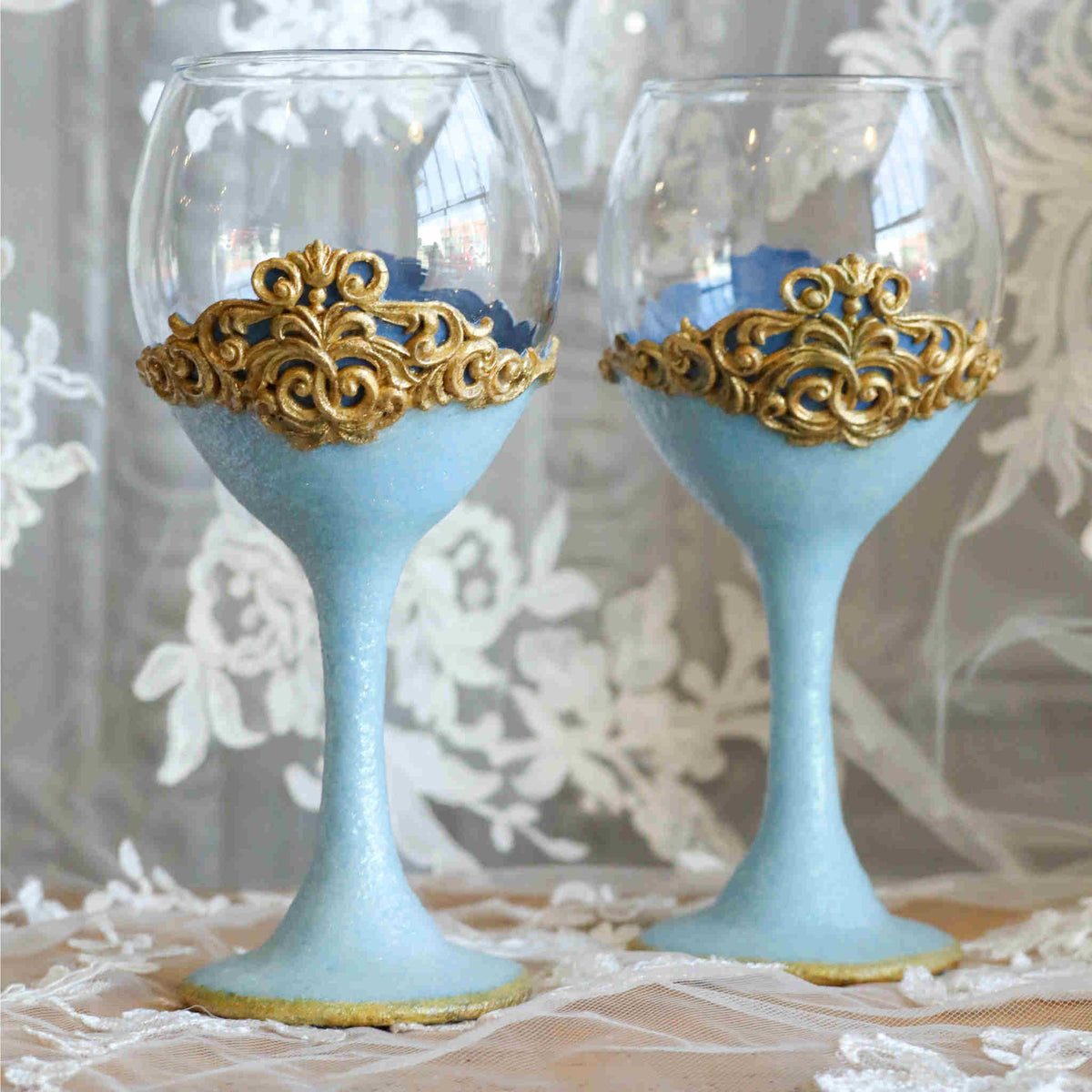 Add a touch of fairytale splendor and enchanted romance with our steamware set. It is the perfect way to add a little sparkle and a special touch of color. Makes a wonderful gift for engagements, showers, weddings and anniversaries. Each wine glass is hand-scuplted with polymer clay blue base and stem that shimmers with a touch of glitter. A gold leaf accents the bottom edge and &quot;lace&quot; top.